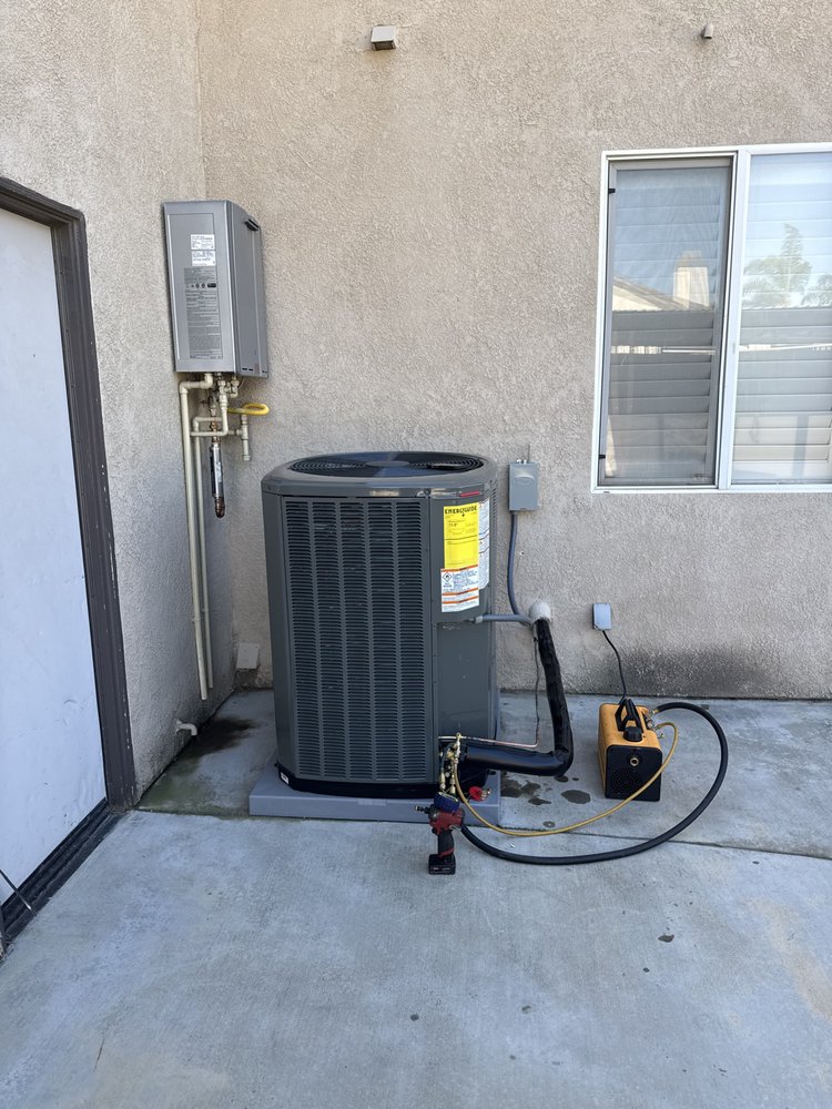 New outdoor AC condenser installed beside a Southern California home